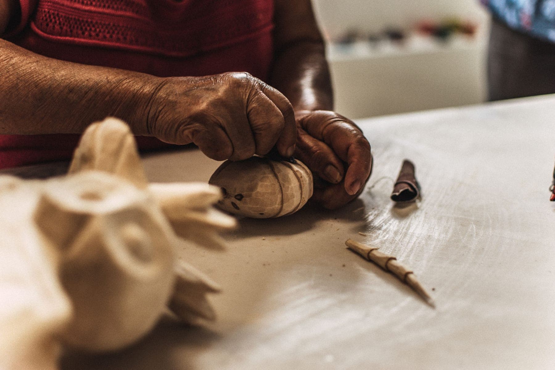 Artisan carving a bespoke timber detail by hand