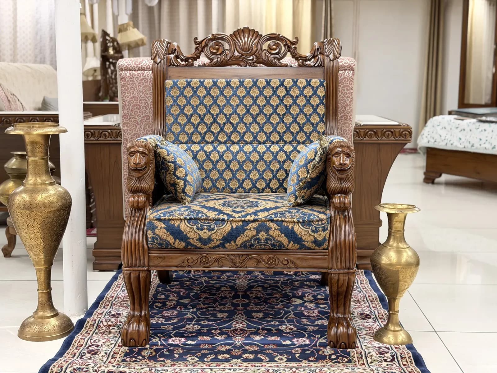 Completed Royal Lion Throne Singhasan in blue and gold jacquard with carved lion heads and brass urns